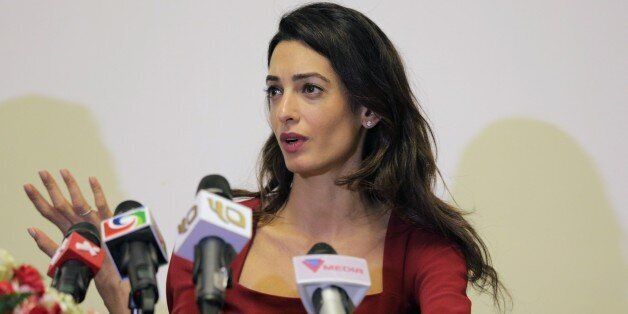 Human rights lawyer Amal Clooney speaks at a press conference at the Kurumba Maldives resort in the Maldives island of Vihamanafushi on September 10, 2015. Clooney attended a court hearing September 10 in the Maldives where state prosecutors have done a U-turn to appeal the conviction of former president Mohamed Nasheed. AFP PHOTO (Photo credit should read STR/AFP/Getty Images)