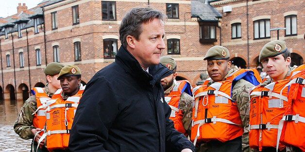 Prime Minister David Cameron greets soldiers working on flood relief in York city centre after the river Ouse burst its banks in North Yorkshire.