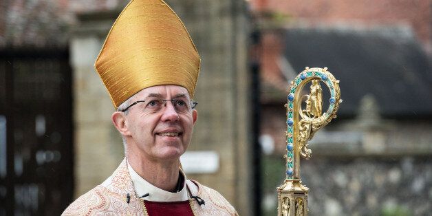 The Archbishop of Canterbury, Justin Welby, arrives at the west door to deliver his Christmas Day sermon to the congregation at Canterbury Cathedral on December 25, 2015.