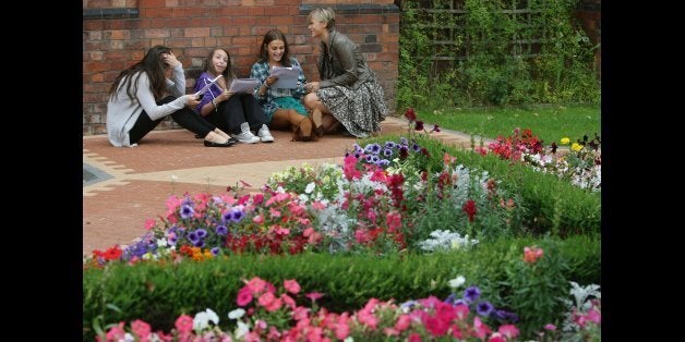 Students from Withington Girls School in Withington, Manchester, compare their A-level results.