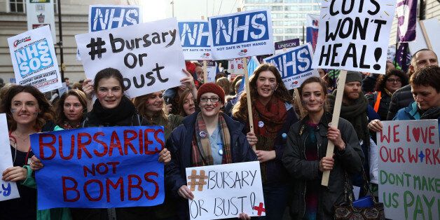 LONDON, ENGLAND - JANUARY 09: Student nurses and health workers take part in a demonstration against government plans to scrap the NHS bursary on January 9, 2016 in London, England. The government are proposing to scrap the bursary and from 2017, are asking future nurses, midwives and other allied health professionals to pay up to Â£50,000 to train to care. Future nurses and midwives will find it extremely difficult if not impossible to pay this debt off. (Photo by Carl Court/Getty Images)