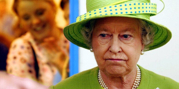 Queen Elizabeth II looks at some cheeses during her visit to the Royal Welsh Show at Builth Wells. Wales' First Minister Rhodri Morgan came under fire today for arriving too late to greet the Queen at the Royal Welsh Agricultural Show. Mr Morgan was apparently stuck in traffic on one of the gridlocked roads leading to the event showground in Builth Wells, mid-Wales.