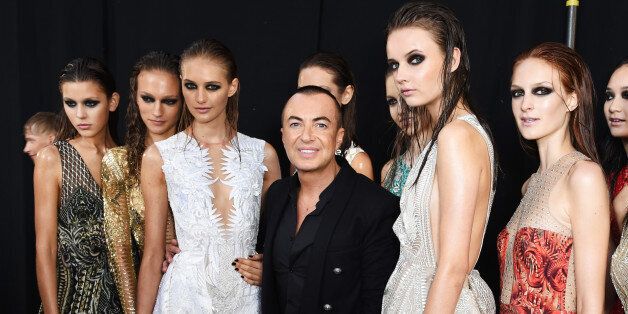 LONDON, ENGLAND - SEPTEMBER 19: Julien MacDonald (C) poses backstage with models at the Julien MacDonald Spring/Summer 2016 Collection during London Fashion Week at Smithfields Market on September 19, 2015 in London, England. (Photo by David M. Benett/Getty Images for Julien MacDonald)