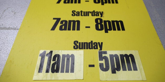 LONDON, ENGLAND - JULY 14: Store opening times are displayed on July 14, 2015 in London, England. Chancellor George Osborne is planning to relax a 21 year old law meaning that shops in England and Wales could be allowed to stay open longer on Sundays. (Photo by Dan Kitwood/Getty Images)