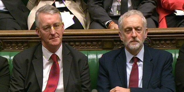 Shadow foreign secretary Hilary Benn (left) and Labour Party leader Jeremy Corbyn look on in the House of Commons yesterday