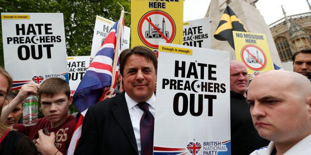 British National Party (BNP) leader Nick Griffin, centre, amongst his supporters during a demonstration in central London, Saturday, June 1, 2013. BNP supporters gathered to protest the May 22 killing of British soldier Lee Rigby. (AP Photo/Lefteris Pitarakis)
