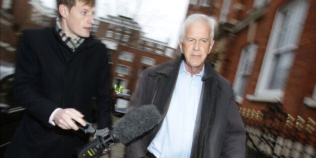 Environment Agency chairman Sir Philip Dilley leaves his flat in Marylebone, London, after arriving back in the country following a sunshine holiday in the Caribbean.