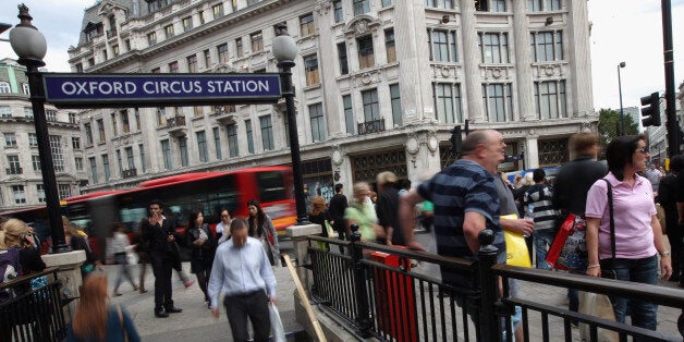 LONDON, ENGLAND - SEPTEMBER 06: Commuters make their way onto an Underground tube station at Oxford Circus on September 6, 2010 in London, England. A 24 hour strike by Tube staff belonging to the RMT and TSSA unions in protest over plans to axe 800 station managerial jobs and ticket office staff is due to commence this evening disrupting rush hour commuters across the capital. (Photo by Dan Kitwood/Getty Images)