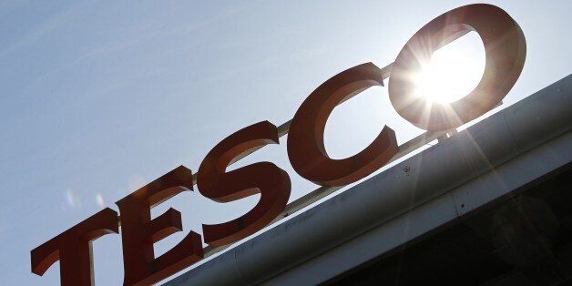 A Tesco logo is pictured at a supermarket in west London on April 22, 2015. Britain's biggest retailer, supermarket group Tesco, announced Wednesday that it had plunged massively into the red last year as it took a hit on the value of its property. AFP PHOTO / ADRIAN DENNIS (Photo credit should read ADRIAN DENNIS/AFP/Getty Images)