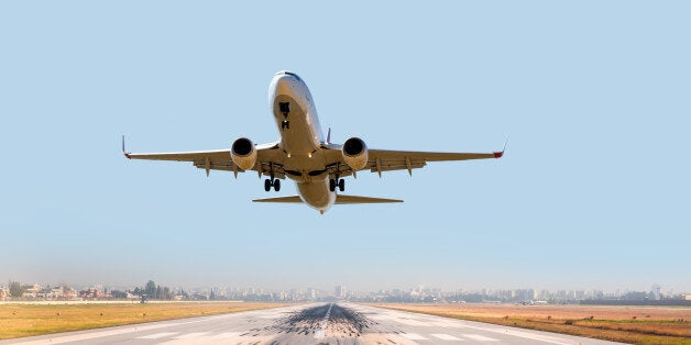 passenger plane fly up over take-off runway from airport