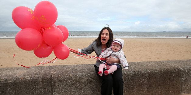 Scottish Labour Deputy Leader Kezia Dugdale with seven month old Sadie Chambers from Edinburgh at Portobello beach whilst on the General Election campaign trail.