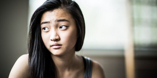 portrait of teenage girl on couch