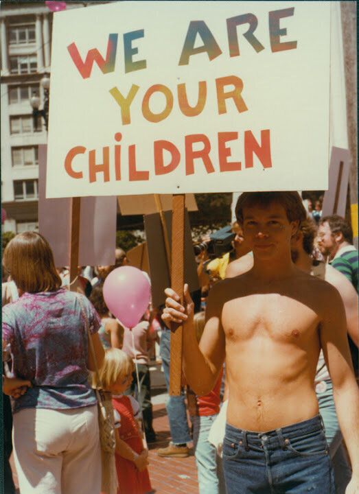 Man Holds A 'We Are Your Children' Sign On Gay Freedom Day At The San Francisco Pride Parade - June 25, 1978