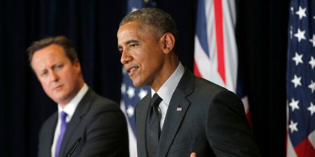 President Barack Obama and British Prime Minister David Cameron participate in a news conference at the G7 summit in Brussels, Belgium, Thursday, June 5, 2014. (AP Photo/Charles Dharapak)