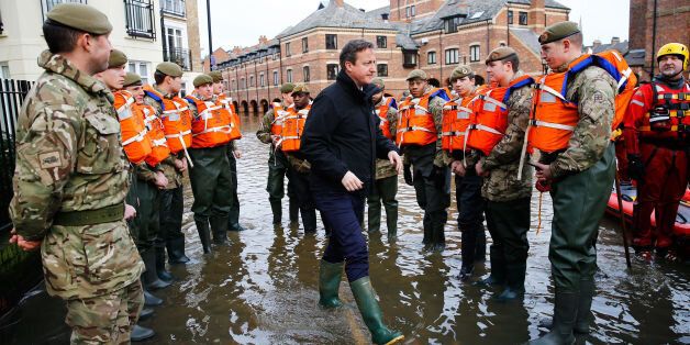 David Cameron meets soldiers working on flood relief in York city centre after the river Ouse burst its banks in December