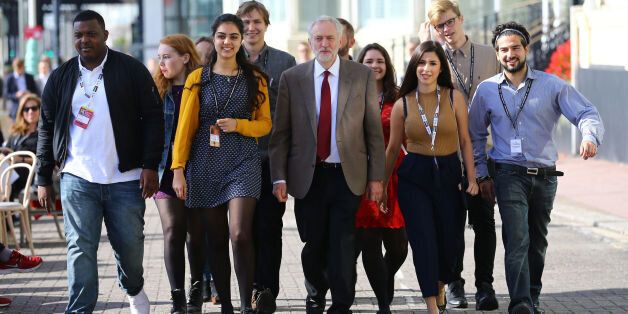 Jeremy Corbyn arriving with supporters at the Brighton Centre in Brighton, Sussex to make his first speech as leader to the Labour Party conference at the Brighton Centre in Brighton, Sussex.
