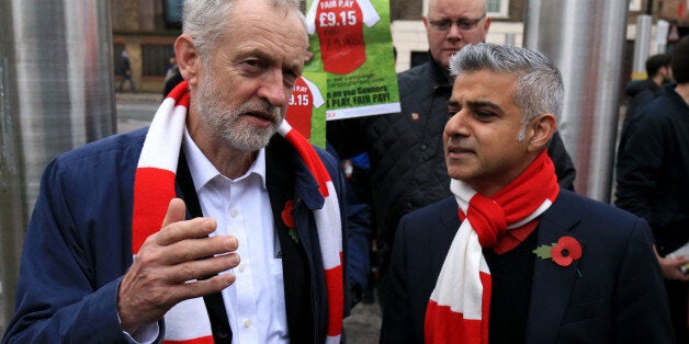 Labour leader Jeremy Corbyn with London mayoral candidate Sadiq Khan MP and fans protesting against the Living Wage before the Barclays Premier League match at the Emirates Stadium, London. PRESS ASSOCIATION Photo. Picture date: Sunday November 8, 2015. See PA story SOCCER Arsenal. Photo credit should read: Nigel French/PA Wire. EDITORIAL USE ONLY No use with unauthorised audio, video, data, fixture lists, club/league logos or