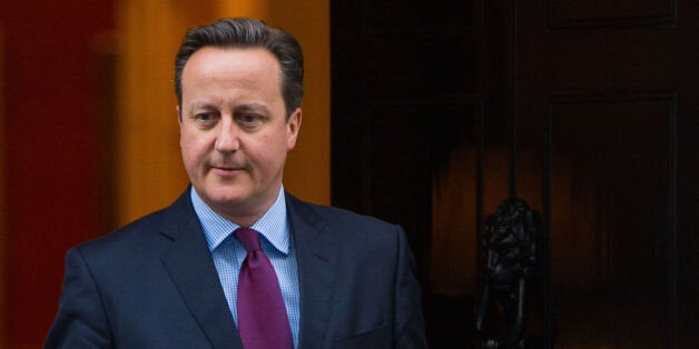 Prime Minister David Cameron prepares to meet Queen Rania of Jordan (not pictured) outside 10 Downing Street, in Westminster, London.