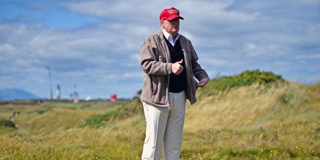Republican Presidential Candidate Donald Trump drives a golf buggy during his visits to his Scottish golf course Turnberry in July