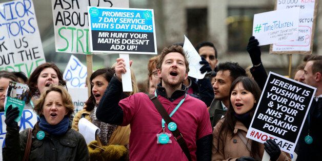 Protesters outside St Thomas' Hospital in London as junior doctors go on strike for 24 hours in a dispute with the government over new contracts.