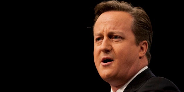 British Prime Minister David Cameron delivers his keynote speech on the final day of the Conservative Party Conference, Manchester, England, Wednesday, Oct. 2, 2013. Cameron says Britain is on the road to financial recovery, and his Conservative Party will unleash economic energy to make it