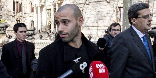 FC Barcelona's player Javier Mascherano (C) leaves the Barcelona's law court after his trial for unpaid taxes in Barcelona, Spain on January 21, 2016. (Photo by Albert Llop/Anadolu Agency/Getty Images)