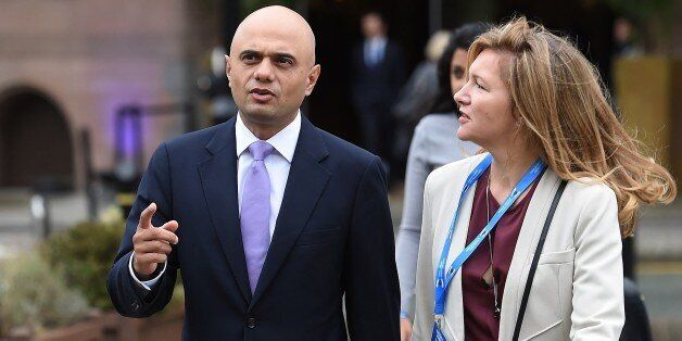 British Secretary of State for Business, Innovation and Skills, Sajid Javid (L) arrives to address delegates on the second day of the annual Conservative party conference in Manchester, north west England, on October 5, 2015. AFP PHOTO / PAUL ELLIS (Photo credit should read PAUL ELLIS/AFP/Getty Images)