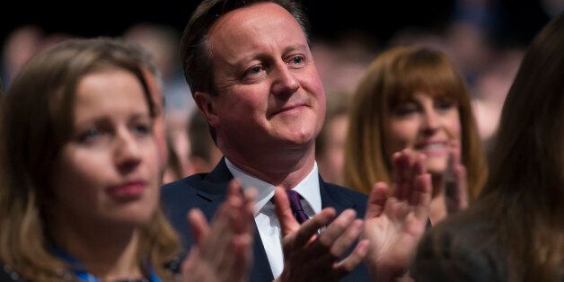 British Prime Minister David Cameron applauds after listening to a speech by Chancellor of the Exchequer George Osborne, during the Conservative Party Conference, in Manchester, England, Monday Oct. 5, 2015. The ruling Conservative Party continue their annual conference on Monday, seemingly buoyant after their electoral triumph in May. (AP Photo/Jon Super)