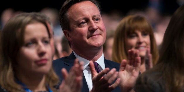 British Prime Minister David Cameron applauds after listening to a speech by Chancellor of the Exchequer George Osborne, during the Conservative Party Conference, in Manchester, England, Monday Oct. 5, 2015. The ruling Conservative Party continue their annual conference on Monday, seemingly buoyant after their electoral triumph in May. (AP Photo/Jon Super)