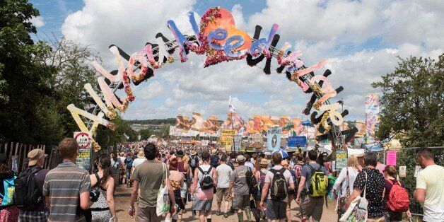 Festival goers walk across the Glastonbury site, on day 3 of Glastonbury festival 2015, Worthy Farm, Somerset.