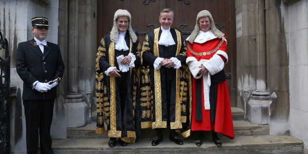 LONDON, ENGLAND - MAY 19: Michael Gove (2R) stands with Master of the Rolls, Lord Dyson (2L) and The Lord Chief Justice Baron Thomas of Cwmgiedd (R) as he arrives at The Royal Courts of Justice to be sworn in as Lord Chancellor on May 19, 2015 in London, England. Mr Gove replaces Chris Grayling as Lord Chancellor and Justice Secretary in the new government. (Photo by Peter Macdiarmid/Getty Images)