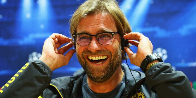Jurgen Klopp manager of Borussia Dortmund laughs during a Borussia Dortmund press conference, ahead of the UEFA Champions League Group D match against Arsenal, at Emirates Stadium on November 25, 2014 in London, England. (Photo by Ian Walton/Getty Images)