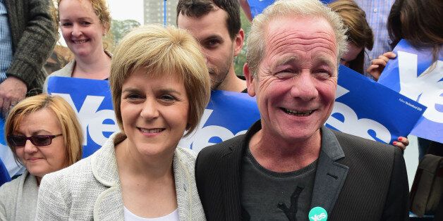 GLASGOW, SCOTLAND - SEPTEMBER 12: Deputy First Minister Nicola Sturgeon (L) and actor Peter Mullan campaign for the 'Yes' vote in Drumchapel on September 12,2014 in GlasgowScotland. With less than a week to go, the latest polls in Scotland's independence referendum puts the No campaign back in the lead, the first time they have gained ground on the Yes campaign since the start of August. (Photo by Jeff J Mitchell/Getty Images)