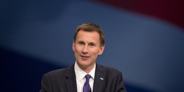 British Secretary of State for Health Jeremy Hunt addresses delegates on the third day of the annual Conservative party conference in Manchester, north west England on October 6, 2015. AFP PHOTO / OLI SCARFF (Photo credit should read OLI SCARFF/AFP/Getty Images)