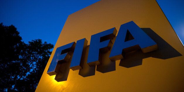 ZURICH, SWITZERLAND - JUNE 02: A FIFA logo sits on a sign at the FIFA headquarters on June 2, 2015 in Zurich, Switzerland. Joseph S. Blatter resigned as president of FIFA. The 79-year-old Swiss official, FIFA president for 17 years said a special congress would be called to elect a successor. (Photo by Philipp Schmidli/Getty Images)