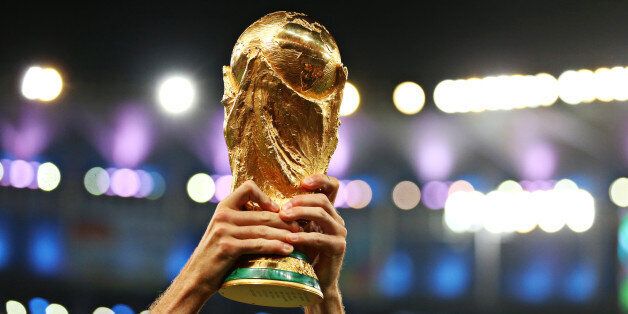 Detail of a Germany player lifting the FIFA World Cup Trophy