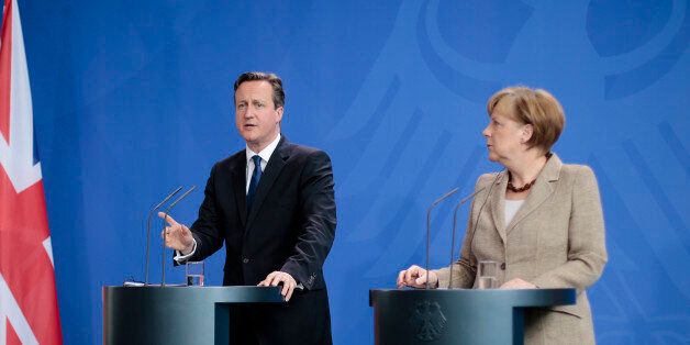 German Chancellor Angela Merkel, right, and British Prime Minister David Cameron (AP Photo/Markus Schreiber)