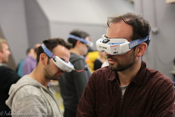 Pilots watch others race through goggles