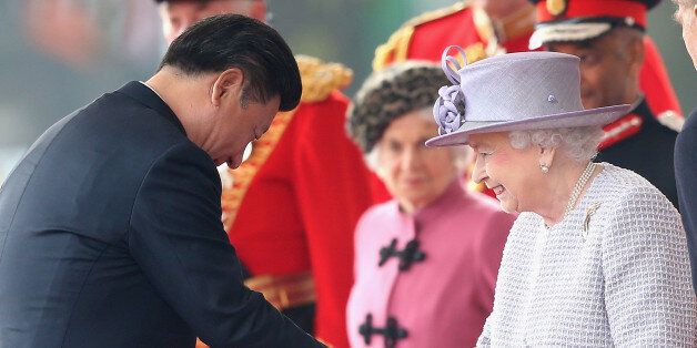LONDON, ENGLAND - OCTOBER 20: Queen Elizabeth II shakes hands with Chinese President Xi Jinping on Horseguards Parade during the Official Ceremonial Welcome for the Chinese State Visit on October 20, 2015 in London, England. The President of the Peoples Republic of China, Mr Xi Jinping and his wife, Madame Peng Liyuan, are paying a State Visit to the United Kingdom as guests of The Queen. They will stay at Buckingham Palace and undertake engagements in London and Manchester. The last state vis