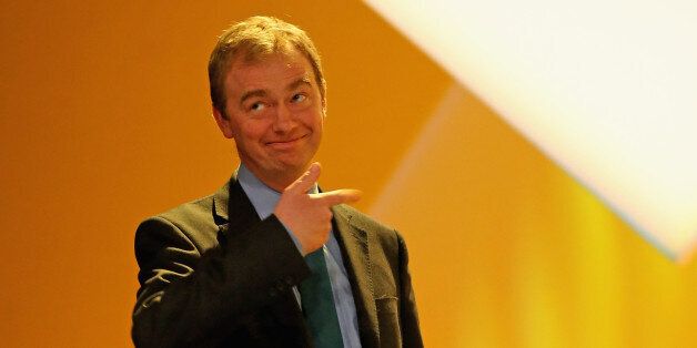 LIVERPOOL, ENGLAND - MARCH 15: Tim Farron MP carries the Lib DEm 'budget box' on to the stage during the party's spring conference at the ACC on March 15, 2015 in Liverpool, England. Deputy Prime Minister Nick Clegg is expected to rally members and that the Lib Dems will do 'better than anyone thinks' during the general election on 7th May. (Photo by Christopher Furlong/Getty Images)