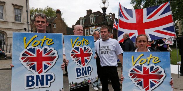 Members of the British National Party (BNP), hold placards during a demonstration in central London, Saturday, Jun. 1, 2013. British National Party supporters gathered to protest the May 22 killing of British soldier Lee Rigby. (AP Photo/Lefteris Pitarakis)