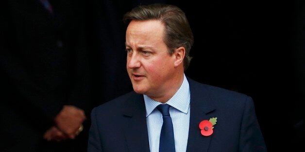 Prime Minister David Cameron leaves after his lunch with China's President Xi Jinping at Manchester Town Hall in Manchester on the last day of his state visit to the UK.