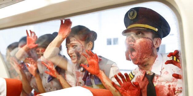 CHENGDU, CHINA - OCTOBER 30: (CHINA OUT) Students of Sichuan Southwest Vocational College of Civil Aviation perform horrible fight on the B737-800 during a training lesson on October 30, 2015 in Chengdu, Sichuan Province of China. Students of Sichuan Southwest Vocational College of Civil Aviation made up to perform in a horrible fight on the B737-800 airplane during a training lesson on Friday ahead of the Halloween. (Photo by ChinaFotoPress/ChinaFotoPress via Getty Images)