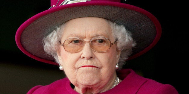 NEWBURY, UNITED KINGDOM - APRIL 17: (EMBARGOED FOR PUBLICATION IN UK NEWSPAPERS UNTIL 48 HOURS AFTER CREATE DATE AND TIME) Queen Elizabeth II watches her horse 'Capel Path' run in the Dubai Duty Free Full of Surprises Handicap Stakes during the Dubai Duty Free Spring Trials Meeting at Newbury Racecourse on April 17, 2015 in Newbury, England. (Photo by Max Mumby/Indigo/Getty Images)