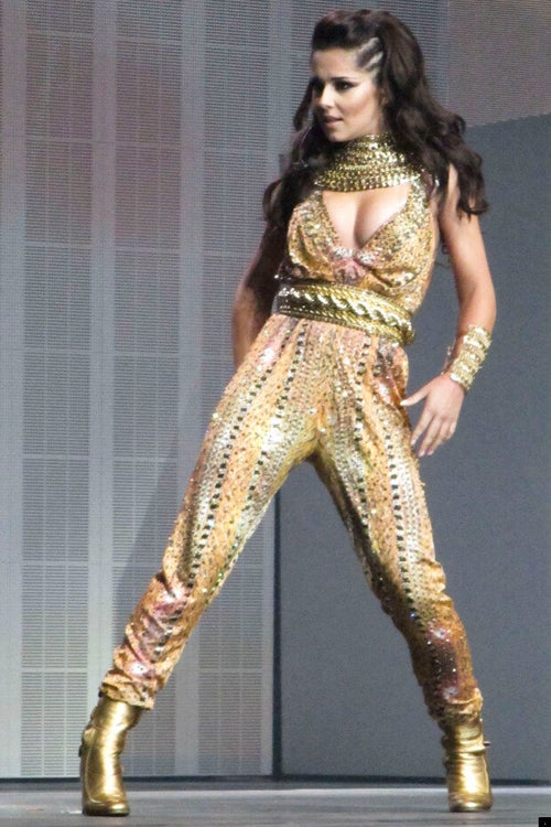 cheryl cole gold dress Cheryl Cole proved once again why she is hailed as a style icon when she celebrated her birthday in a show-stopping outfit that left fans and fashion critics swooning. The Girls Aloud