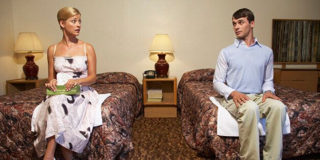 Nervous Couple in Motel Room