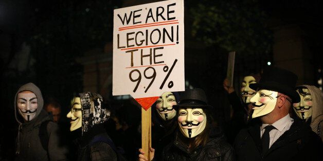 Protestors demonstrate outside Leinster House in Dublin as part of a planned Anonymous Million Mask March to mark Guy Fawkes Day