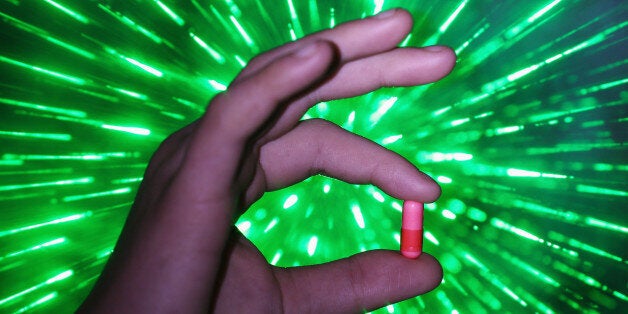 MANCHESTER, ENGLAND - FEBRUARY 26: A youth holds a 'Legal High' chemical pill on February 26, 2015 in Manchester, England. There has been a significant rise in the use of Legal Highs that are actually not against the law. They contain one or more chemical substances which produce similar effects to illegal drugs and can be purchased in local 'Headshops.' The 'highs' are not controlled under the Misuse of Drugs Act 1971 and can be purchased in many forms including pills, potions and herbs. (Photo Illustration by Christopher Furlong/Getty Images)