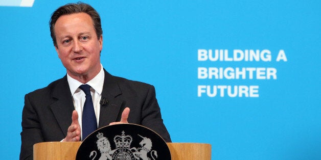 Prime Minister David Cameron talks to students during a visit to Ormiston Bolingbroke Academy in Runcorn, where he signalled that ministers are preparing deep cuts to tax credits as he defended the Government's plans to slash £12 billion from the welfare bill.