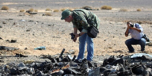 Egyptian officials inspect the crash site of Russian Airliner in Suez, Egypt on November 01, 2015. A Russian Airbus-321 airliner with 224 people aboard crashed in Egypt's Sinai Peninsula on yesterday. According to Egypts Civil Aviation Authority, the plane had been lost contact with air-traffic controllers shortly after taking off from the Egyptian Red Sea resort city of Sharm el-Sheikh en route to St Petersburg. (Photo by Alaa El Kassas/Anadolu Agency/Getty Images)